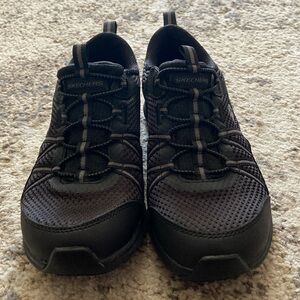 Skechers black slip on sneakers. Size 5
